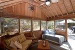 3 Season Porch with seating and daybed with trundle